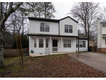 Two-story house with white siding, driveway, and mature trees at 592 Waynes Ct, Atlanta, GA 30354