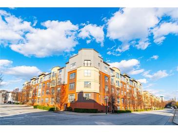 Modern apartment building with brick and yellow siding, offering city views at 400 17Th Nw St # 2118, Atlanta, GA 30363