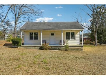 Cute bungalow with front porch and large yard at 1111 Park Nw Cir, Conyers, GA 30012