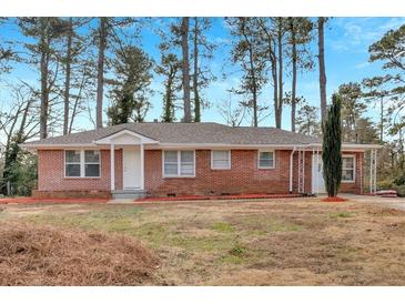 Brick ranch home with a large yard at 4223 Welbron Dr, Decatur, GA 30035