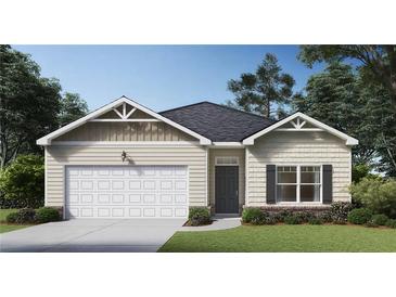 Charming single-story home with a two-car garage, gray door, and classic architectural details at 8587 Seabiscuit Rd, Lithonia, GA 30058
