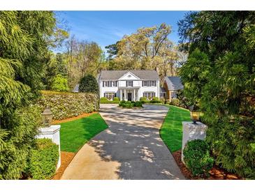 Elegant home with circular driveway and manicured lawn at 3382 Habersham Nw Rd, Atlanta, GA 30305