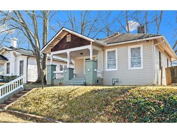 Charming craftsman bungalow with a covered porch and well-manicured lawn at 135 Adair Se Ave, Atlanta, GA 30315