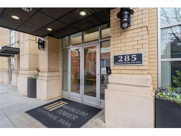 Museum Tower building exterior showcasing the entrance and address at 285 Centennial Olympic Park Nw Dr # 1407, Atlanta, GA 30313