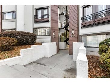 Exterior view of building entrance showing clean walkway and well-maintained landscaping at 1445 Monroe Ne Dr # B7, Atlanta, GA 30324