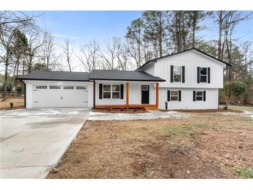 Newly renovated farmhouse-style home with a charming front porch at 85 Hickory Dr, Stockbridge, GA 30281