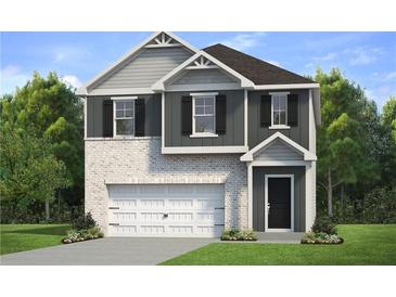 Two-story house with gray siding, white garage door, and landscaping at 17 Camellia Dr, Fairburn, GA 30213