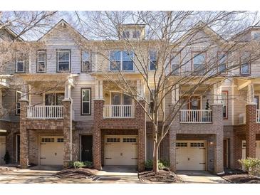 Brick townhouses with attached garages and balconies at 887 Commonwealth Se Ave, Atlanta, GA 30312