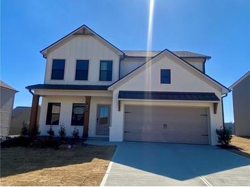 Beautiful two-story home with a two-car garage and neutral color scheme at 414 Westmarch Cir, Loganville, GA 30052