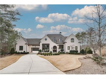 Stunning white brick home with a charming front porch and landscaping at 2518 Dawsons Pt, Duluth, GA 30097