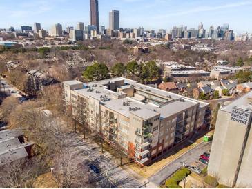 Aerial view of a modern apartment building in a vibrant city setting at 384 Ralph Mcgill Ne Blvd # 404, Atlanta, GA 30312