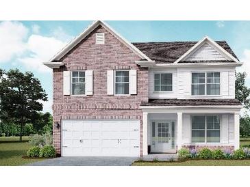 Two-story brick and white house with a three-car garage at 500 Paces Dr, Lithia Springs, GA 30122