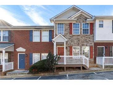 Two-story brick townhouse with a front porch and landscaping at 3607 Ginnis Sw Dr # 7, Atlanta, GA 30331