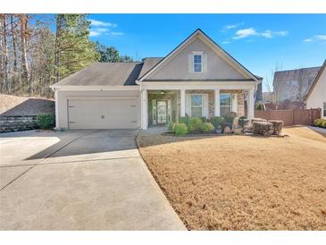 Charming one-story house with gray siding, a two-car garage, and a well-manicured lawn at 501 Olympic Way, Acworth, GA 30102