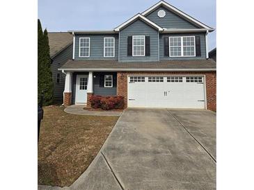 Two-story house with gray siding, brick accents, and a two-car garage at 28 Samuel Nw Way, Cartersville, GA 30121