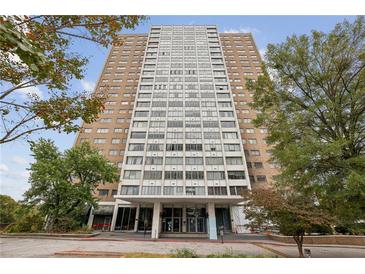 High-rise building exterior with landscaping and entrance at 215 Piedmont Ne Ave # 1707, Atlanta, GA 30308