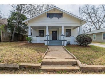 Charming one-story home featuring a covered front porch and a well-maintained yard and front steps at 161 Adair Se Ave, Atlanta, GA 30315