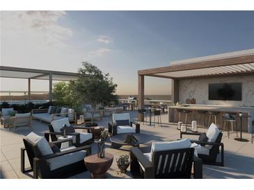 A luxurious rooftop deck with a full outdoor kitchen and lounge area for entertaining and relaxation at 318 Sandy Springs Cir # 250, Sandy Springs, GA 30328