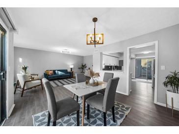 Bright living room features an open layout, dining area, and modern décor at 2678 Greentree Se Dr, Marietta, GA 30067
