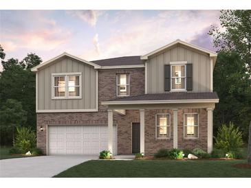 Two-story brick home with a large front porch and attached garage at 7049 Brushwood Bend (Lot 59), Lithonia, GA 30058