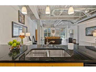 Modern kitchen with stainless steel appliances and granite countertops at 5200 Peachtree Rd # 3116, Chamblee, GA 30341