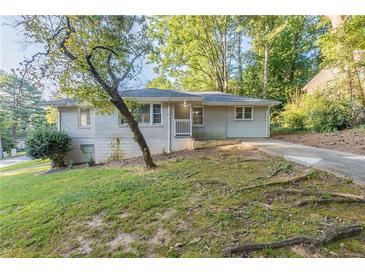 Charming ranch home with a well-maintained lawn and driveway at 3235 Mcafee Rd, Decatur, GA 30032