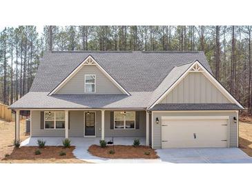Craftsman style home with gray siding, covered porch, and two-car garage at 8980 Callaway Dr, Winston, GA 30187