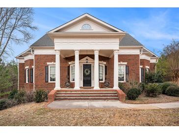 Brick house with a large front porch and columns at 159 Cedar Creek Rd, Cartersville, GA 30121