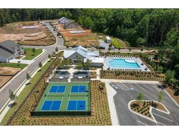 Aerial view of community featuring pool, pickleball courts, and clubhouse at 5330 Memento Trace, Cumming, GA 30040