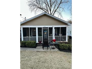 Cute bungalow with a screened porch and landscaped yard at 985 Farrington Se Pl, Atlanta, GA 30315