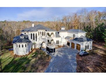 Elegant two-story home with attached garage and expansive driveway at 1628 Golden Creek Sw Ct, Conyers, GA 30094