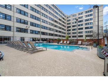 Refreshing community pool with plenty of lounge chairs at 878 Peachtree Ne St # 405, Atlanta, GA 30309