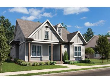 Craftsman style home with gray siding, front porch, and landscaping at 515 Cottage Creek Dr, Cumming, GA 30040