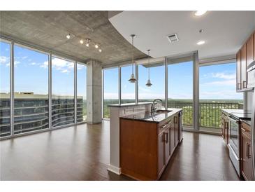 Modern kitchen with stainless steel appliances and granite countertops at 855 Peachtree Ne St # 2914, Atlanta, GA 30308