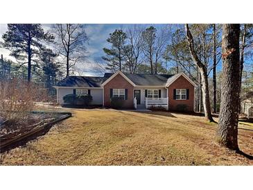 Brick ranch house with front porch, situated on a landscaped lot at 2212 Ashton Dr, Villa Rica, GA 30180