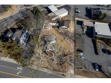 Aerial view of a house and surrounding land with street and parking areas at 2930 Dallas Nw St, Kennesaw, GA 30144