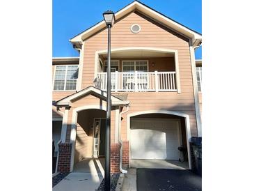 Two-story townhome with attached garage and balcony at 3500 Sweetwater Rd # 424, Duluth, GA 30096