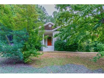Charming single-Gathering home featuring a quaint front porch and mature landscaping at 804 Thomasville Se Blvd, Atlanta, GA 30315
