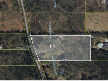 Aerial view showing home, detached garage, and expansive lot at 2360 Mann Rd, Douglasville, GA 30134