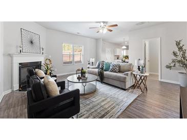 Bright living room with fireplace and hardwood floors at 3178 Cedar Crest Way, Decatur, GA 30034