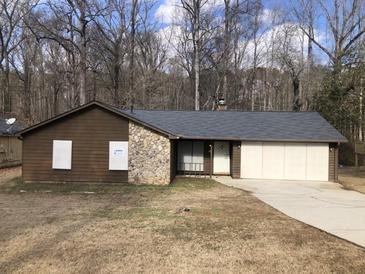 Ranch style home with stone accents and a two-car garage at 1079 Salisbury Trl, Riverdale, GA 30296