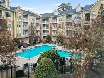 Resort-style pool with surrounding apartment building at 2211 Westchester Rdg, Atlanta, GA 30329