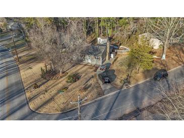 Charming single Gathering home with a well maintained front yard and driveway in a wooded neighborhood at 6460 Boca Grande Blvd, Forest Park, GA 30297