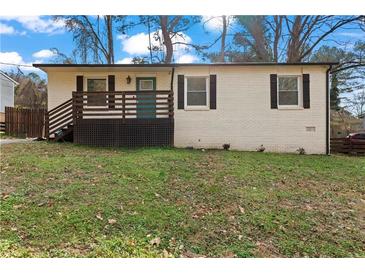 Charming one-story brick home with a cozy front porch and freshly landscaped yard at 2409 Swallow Se Cir, Atlanta, GA 30315