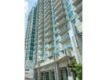 Modern high-rise building with numerous balconies and city views at 250 Pharr Ne Rd # 1704, Atlanta, GA 30305