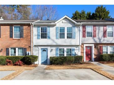 Attractive townhome with light blue door and shutters at 2877 Dresden Square Dr, Atlanta, GA 30341