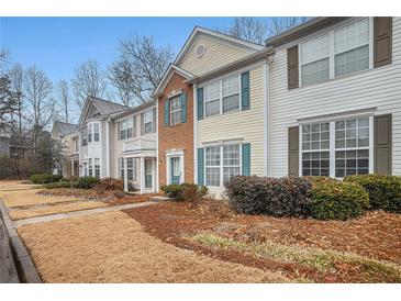 Charming townhomes feature well-maintained landscaping and classic architectural details at 3712 Berkeley Xing, Duluth, GA 30096