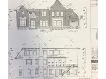 Architectural drawing showing the front and rear elevation of a two-story brick home with multiple windows and a rear deck at 3560 Sky Ln, Cumming, GA 30041