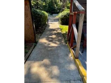 Clean concrete walkway leading to the property entrance at 4654 Hope Springs Rd, Stone Mountain, GA 30083