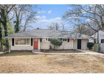 Charming single story home with a red front door and well-maintained landscaping at 2318 Ousley Ct, Decatur, GA 30032